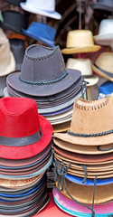 in a old market lots of colorated hats