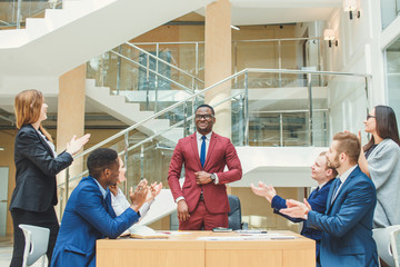 Young African American Business Man leading a team
