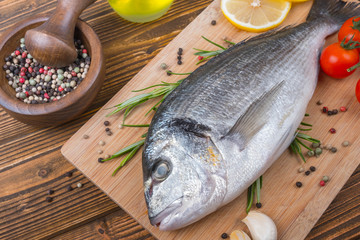 Fresh dorado on wooden background