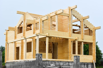 Сonstruction of houses from glued beams (laminated beam).