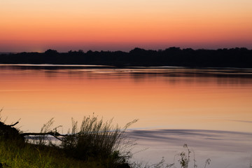 Obraz premium Peaceful river by sunset