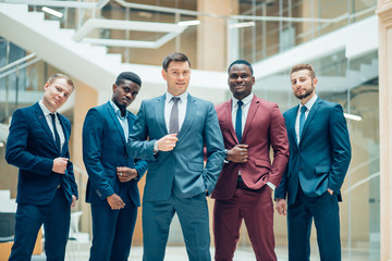 Portrait Of Multi-Cultural Office Staff Standing In Lobby