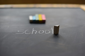 colored crayons on the blackboard