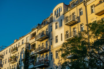 Fototapeta na wymiar apartment houses in warm sunlight