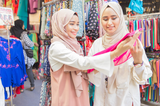 Two muslim women in fabric shop