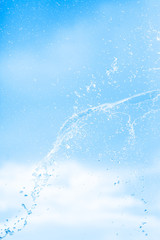 Water splashes against the sky.