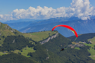 Paragliding above gorgeous mountain Garda Lake near Riva del Garda, start is from mount  Monte Baldo, Italy