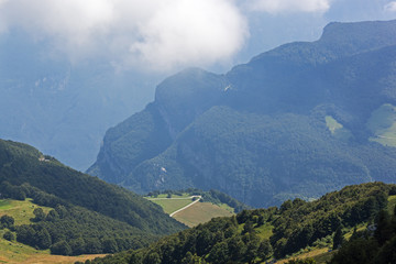 Fototapeta na wymiar Picturesque view of Italian Alps from mount Monte Baldo, Garda Lake, Italy