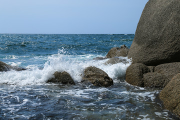 Fototapeta na wymiar Blue sea, stones and waves