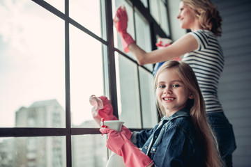 Mom with daughter doing cleaning