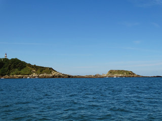 Fototapeta na wymiar Cape Higuer Lighthouse from Sea View