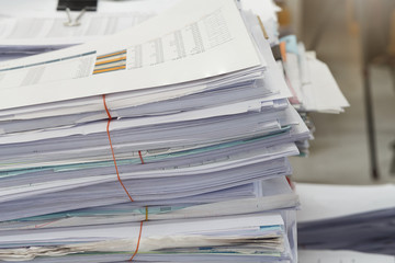Close up of business documents stack on desk , report papers stack