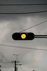 Traffic signals, Stormy sky. The yellow light means careful.
