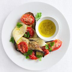 roasted zucchini, eggplant, bell pepper, and tomatoes sprinkled with grated parmesan, and flavoured with lemon juice, olive oil, green herbs, and garlic dressing 