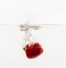 Vegetables throwing into the water