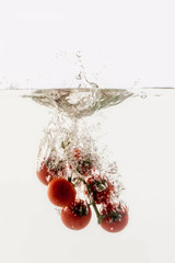 Vegetables throwing into the water