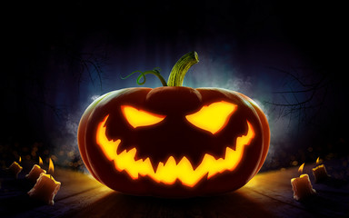 Happy Halloween design with Scary pumpkin 2018. Spooky forest with dead trees and pumpkins. Evil, glowing smile carved on a pumpkin on a dark background. In anticipation of the holiday. 3d render
