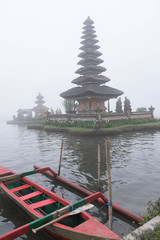 Temple on the lake in the fog