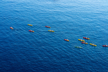 Top view of kayaking in the Adriatic sea. Kayaks aerial photo in Dubrovnik, Croatia.