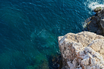 Adriatic sea waves background with top view of tiny rocky isle - Powered by Adobe