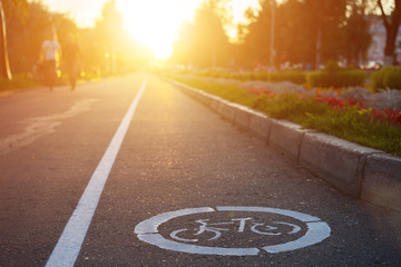 Bike road sign at summer sunset