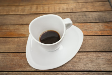 retro white cup and espesso shot on wood background