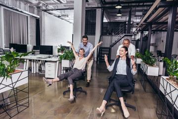 excited business people on chairs