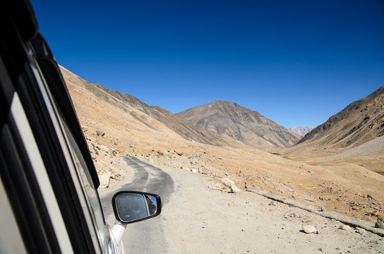 Fototapeta Beautiful lanscape of Sandstone mountain view from car window, Road trip in Leh Ladakh, North of India