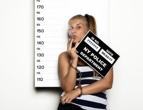 Young beautiful blonde woman with sigarette, Criminal Mug Shots