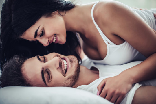 Young love couple in bed