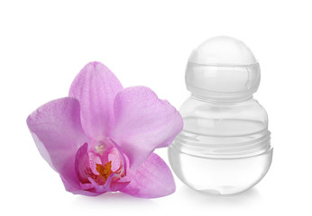 Obraz na płótnie Canvas Female deodorant and orchid flower on white background