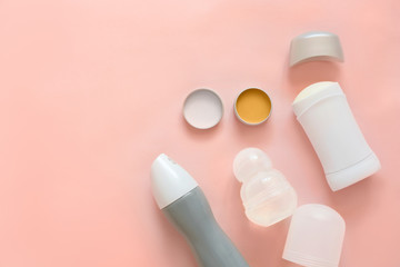 Female deodorants on color background