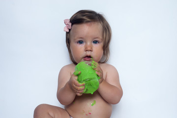 portrait of a cheerful grimy kid. playing with paint