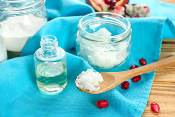 Composition with ingredients for deodorant and spoon on wooden table