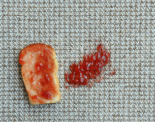 Sandwich with jam on carpet