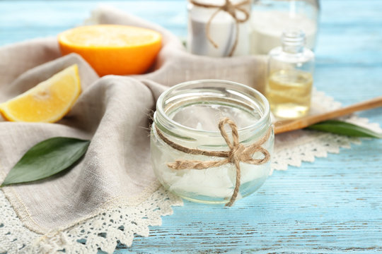 Jar with ingredient for deodorant on wooden table