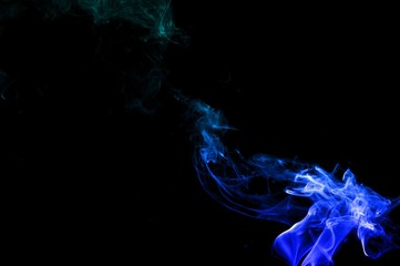 Fototapeta premium Abstract Light blue smoke on black background, Light blue background,Light blue ink background