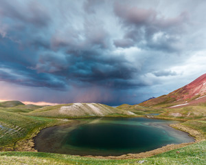 View of Tulpar Kul lake in Kyrgyzstan during the storm