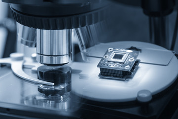 The abstract scene of microscope and the microchip.Hi-precision micro processor  manufacturing concept.