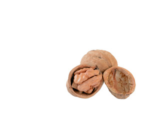 walnut and a cracked walnut isolated on the white background.