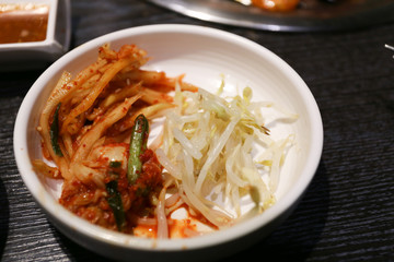 white bean sprouts on white small bowl