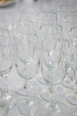 Row of glass on catering event on table.