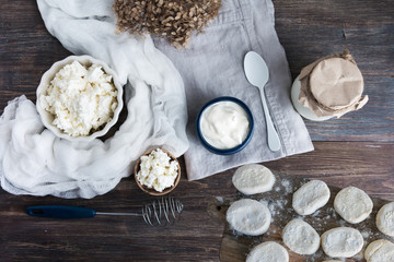 Top view of wooden table with dairy products - milk, youghurt, sour cream - concept of healthy natural eating. Copy space.