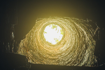 Brick tunnel with light and dark frame