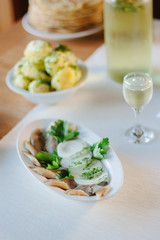 Salty herring on restaurant table.