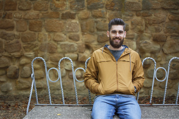 Man sitting enjoying autumn.