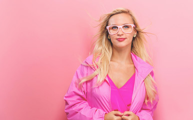 Happy young woman on a solid background