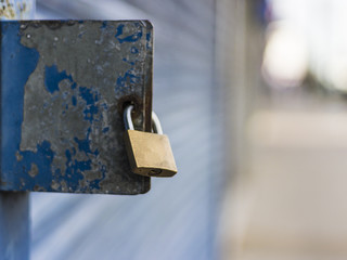 Locked padlock on the front of a street facing shop