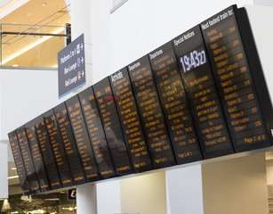 Large train station departure and arrivals board