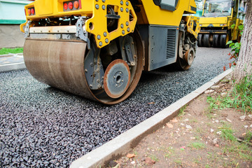 Background of asphalt roller that stack and press hot asphalt. Road repair machine